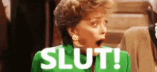 a woman in a green jacket is shocked and says slut !
