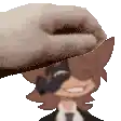 a hand is putting a cowboy hat on a cartoon character .