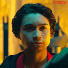 a close up of a man 's face with the word wreck in the corner .