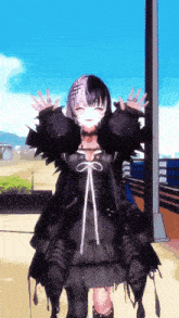 a girl in a black dress stands with her arms outstretched in front of a blue sky