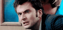 a close up of a man making a funny face .