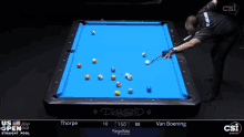 a man is playing pool on a table that says diamond
