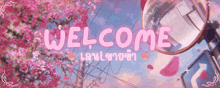 a welcome sign with pink flowers and a mirror