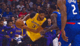 a basketball game is being played in front of a budweiser ad