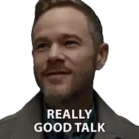 a man with a beard has a sticker on his face that says " really good talk "
