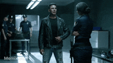 a man in a leather jacket is talking to a police officer in a memex.com photo