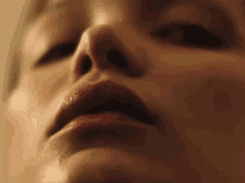a close up of a woman 's mouth with red lips