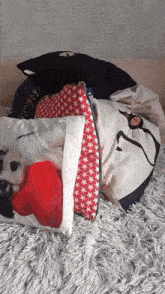 a pile of pillows including one with a picture of a dog