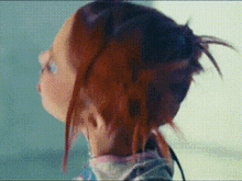 a close up of a person 's head with a bun