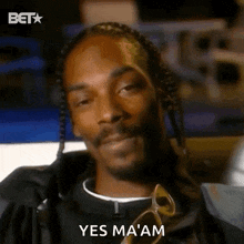 snoop dogg is wearing sunglasses and braids and says yes ma am