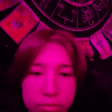 a woman is making a funny face in front of a scorpion zodiac sign