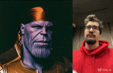 a man in a red hoodie is standing next to a picture of thanos