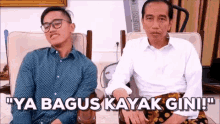 two men are sitting next to each other and one of them says ya bagus kayak gin