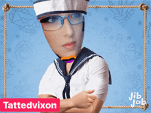 a woman in a sailor outfit with the name tattedvixon on the bottom