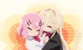 a girl with pink hair is being hugged by another girl with blonde hair