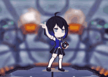a girl with a book in her hand is standing on a stage and pointing