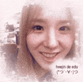 a close up of a woman 's face with the name heejin de edu on the bottom