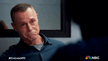 a man with #chicagopd written on the bottom of his shirt