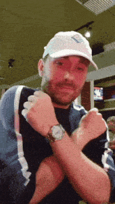 a man wearing a white hat that says ' bud light ' on it