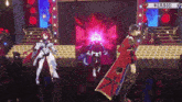 a man and a woman are on a stage with a sign that says #erb3d on it