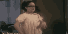 a woman in a white dress is standing in front of a mirror with the words bomberpooer written on the bottom