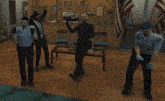 a group of people are dancing in a room with a bulletin board that says 8888