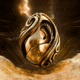 a gold object with a swirl on it