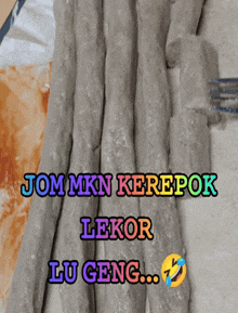 a bunch of sticks with the words jommkn kerepok lekor lu geng