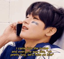 a young man is talking on a cell phone with a caption that says i came into the house and everyone was like oh pretty boy