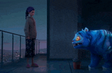 a person standing on a balcony looking at a blue tiger .