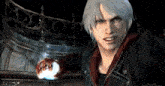 a devil may cry video game character holding a glowing object