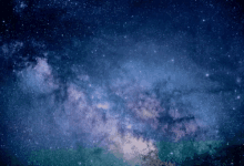 a blue and green galaxy with a lot of stars in it