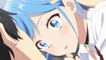 a girl with blue hair is laying on a man 's chest