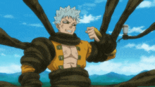 a man in a yellow shirt is tied up with rope