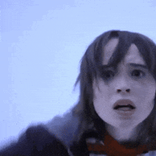 a close up of a woman 's face with a blue background