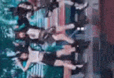 a group of people are standing next to each other in a park .