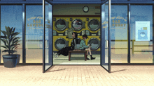 two people sit on a bench in front of a laundromat that says olz laundry