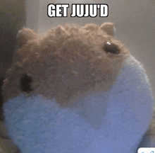 a stuffed animal with the words get juju 'd written on it