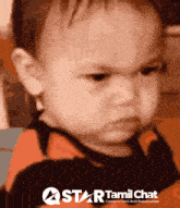 a baby with an angry look on his face is on a star tamil chat poster