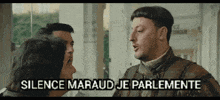 a man talking to another man with the words " silence marlaud je parlamente " written above him
