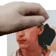 a hand is covering a woman 's face in a pixel art .