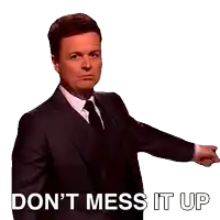 a man in a suit and tie has his hands on his hips and says " do n't mess it up "