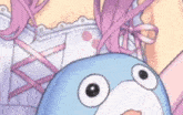a close up of a girl holding a stuffed animal with big eyes .