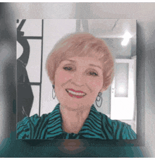 a picture of a woman in a zebra print shirt