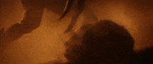 a person 's head is visible in the dark