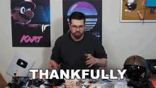 a man says thankfully in front of a poster of mario kart