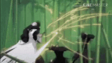 a black and white cat is standing in a bamboo forest with a sword in its mouth .