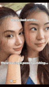 two women are posing for a picture and one of them says honey look at this there 's a single person watching