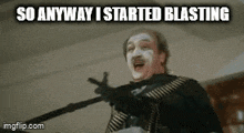 a man with white paint on his face is holding a gun .