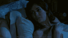 a woman laying in bed with the words " my point is you 're very stressed out okay "